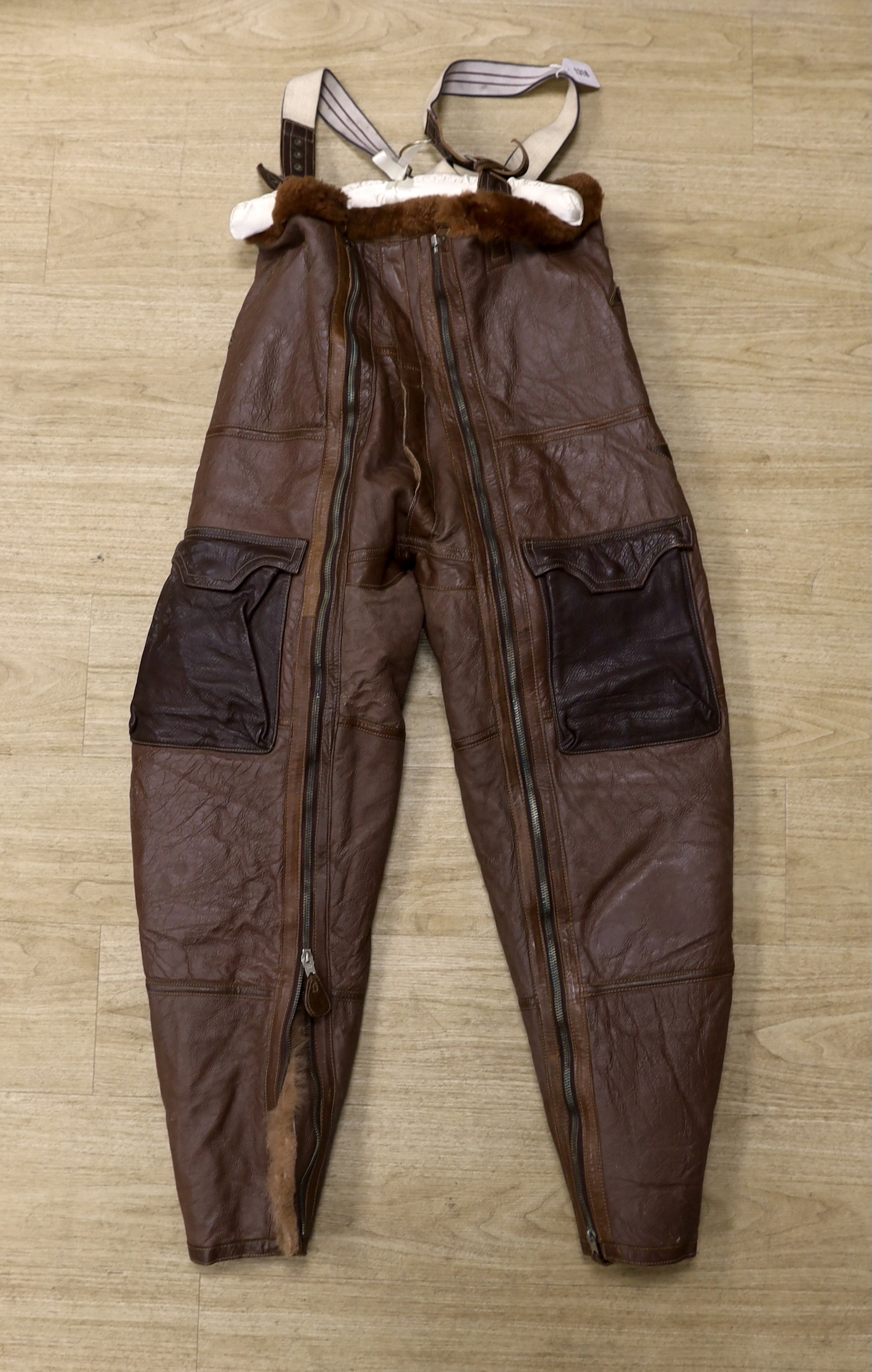 A pair of WWII Air Ministry issue RAF sheepskin breeches, with original label stating; ‘AM, Size: 5, Waist: 34-36, Seat: 40-42, Leg:32.5, 539778’, added in pen; ‘Brown’, provenance - by family descent